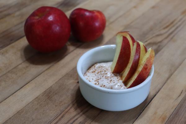 Apple pie fruit dip with apple slices and whole apples