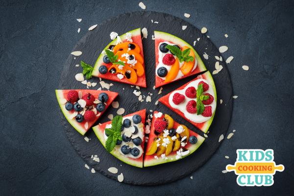 Pizza made with watermelon as crust, yogurt as sauce and fruits for toppings