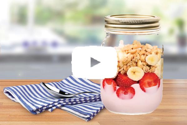 Strawberry and banana parfait in a glass jar