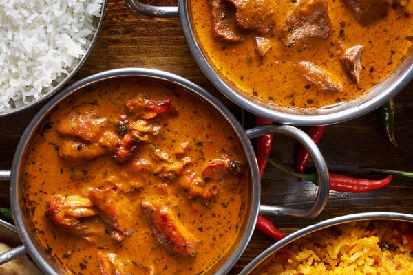 Homemade butter chicken with rice and naan