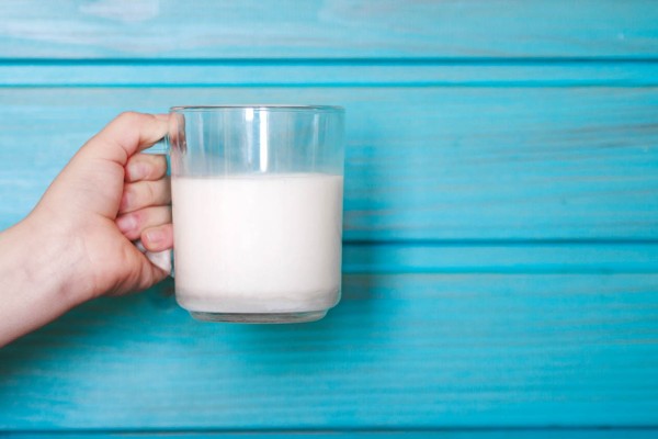 Glass on milk on wooden table