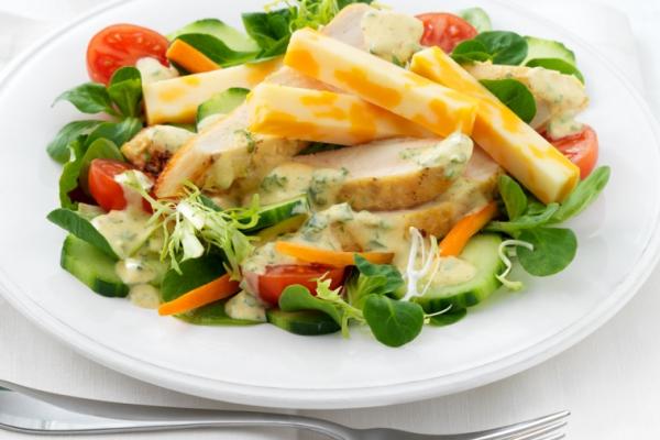 green salad with grilled chicken swiss cheese and curry dressing