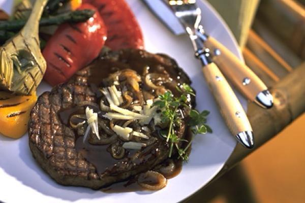 grilled rib eye steak with canadian cheddar and roasted onion sauce