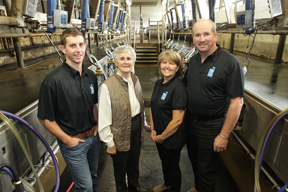 The Werts pose for a family photo in one of their freshly cleaned barns at Stanlee Farm, Ontario.