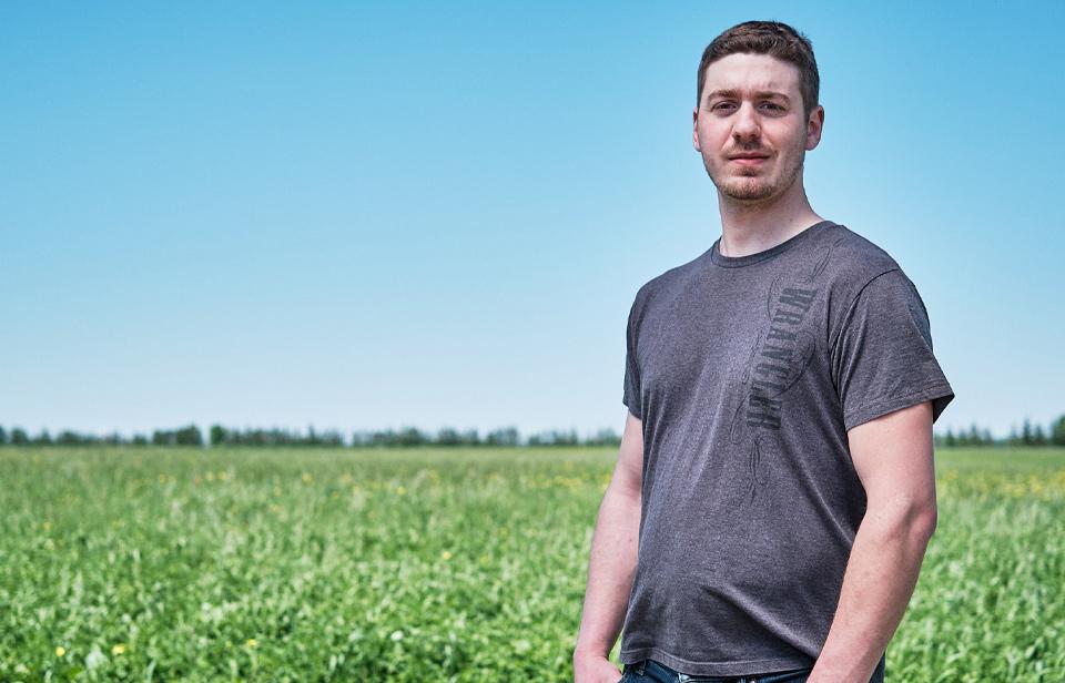 A Canadian dairy farmer in a field