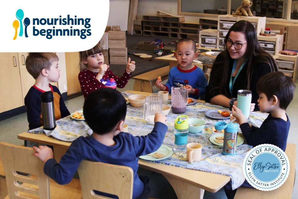 Children sitting around a table eating