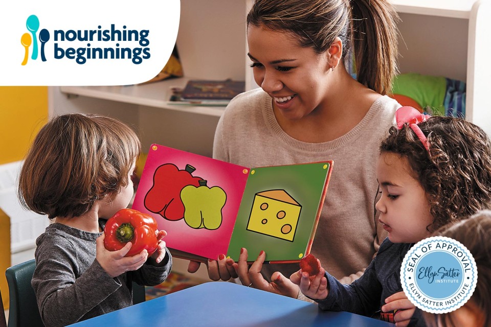 Educator reading a picture book with bell peppers and cheese to two preschool children.