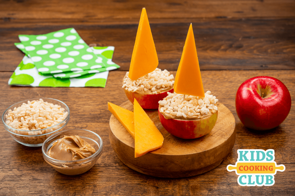 Little sail boats made from an apple as the hull, rice krispie cereal and cheddar cheese for the sail.