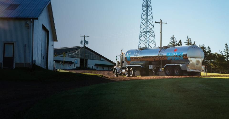 A Dairy Farmes of Canada milk truck arrives at a Canadian farm