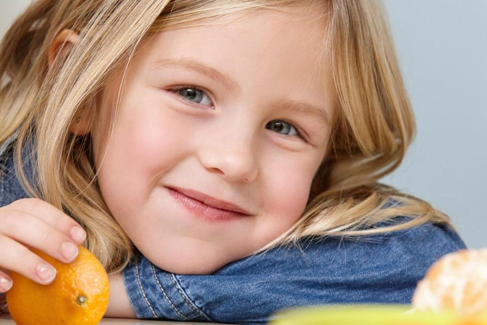 Young girl eating a snack