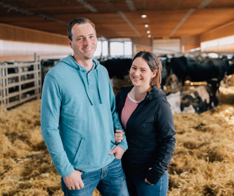 dairy farmers in the barn