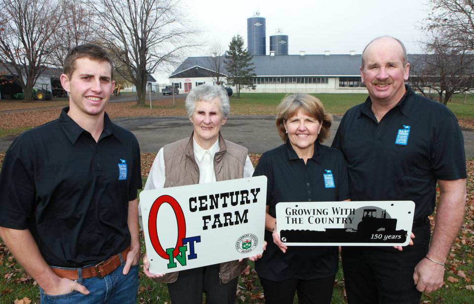 A family of Canadian dairy farmers on a farm