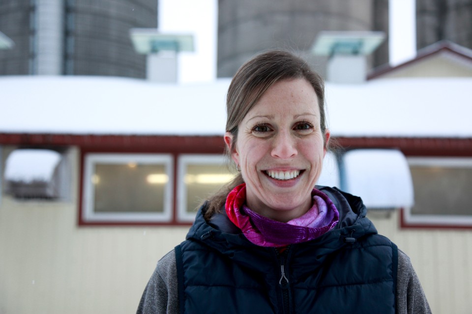 A Canadian dairy farmer in front of a barn