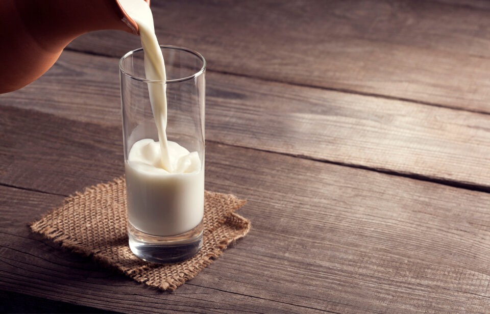 Glass of milk being poured