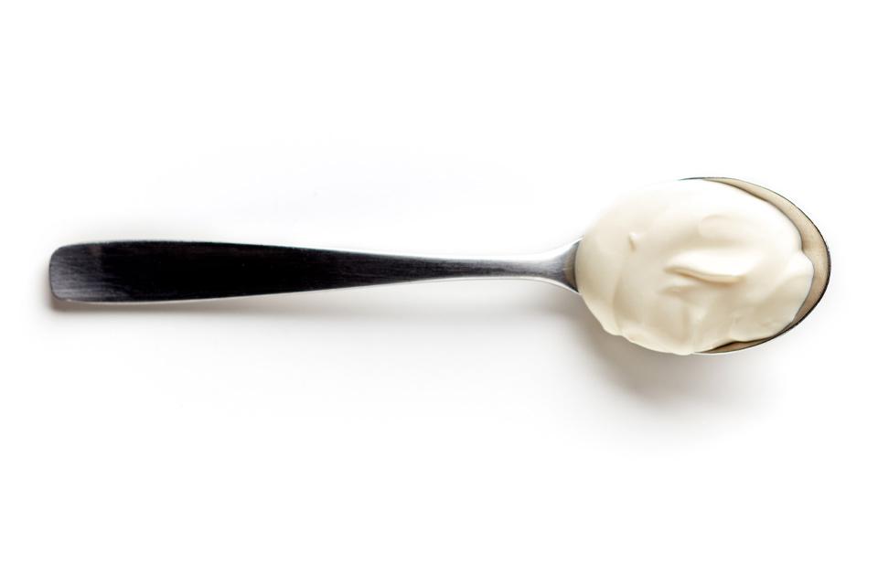 Yogurt on spoon. 