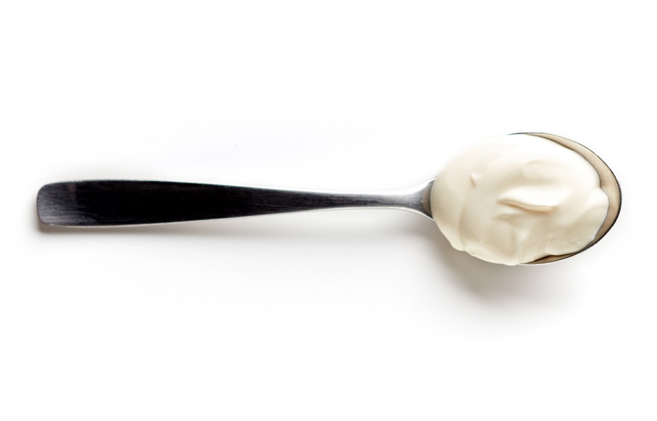 Yogurt on spoon.