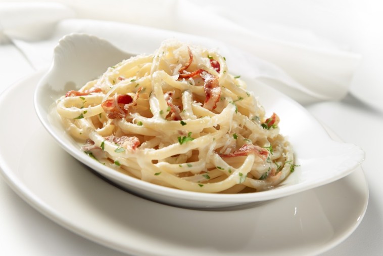 Creamy carbonara pasta served in a white bowl