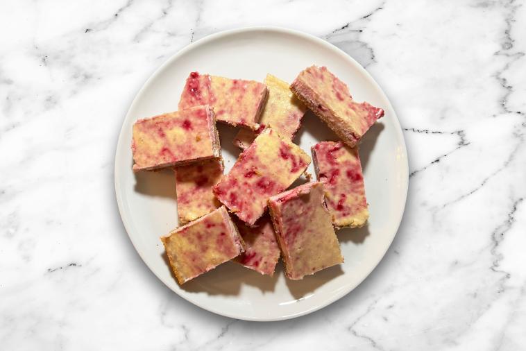 Spiced Eggnog Cheesecake Bars with a Cranberry Swirl