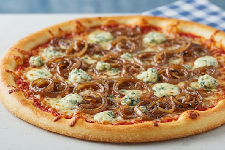 Golden brown pizza with carmalized onions and blue cheese
