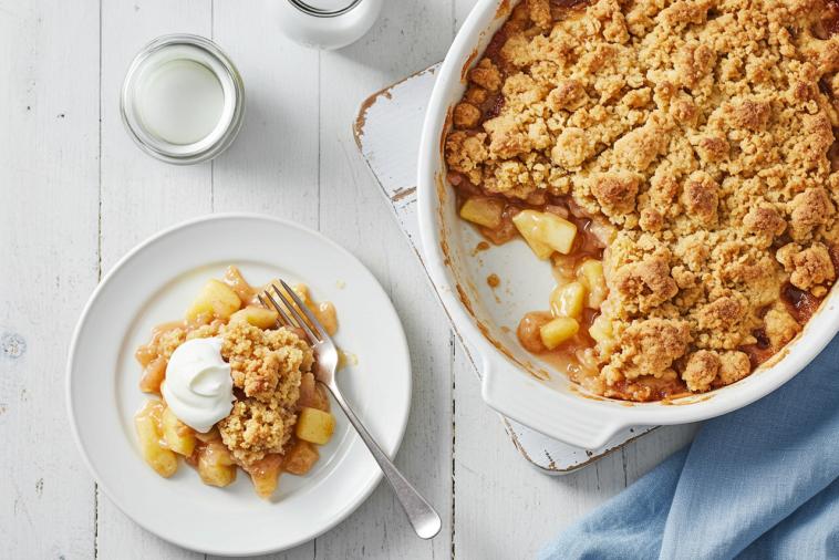 Apple custard crumble in a dish with a casserole next to it