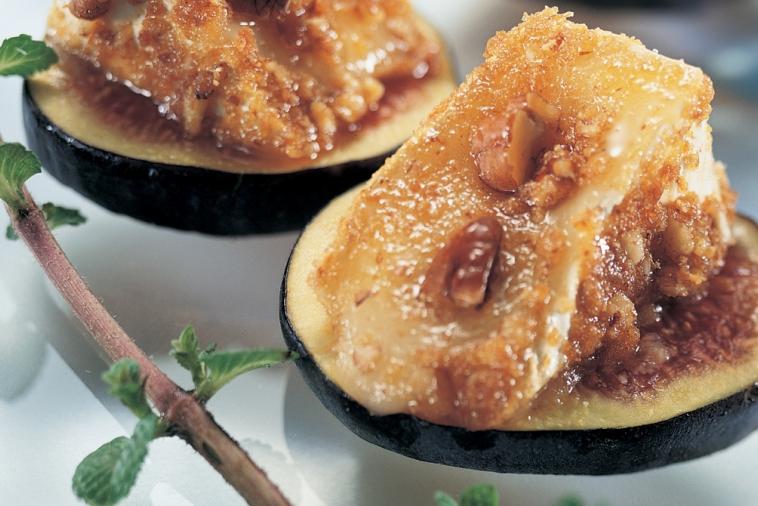 brie canapes with pecans on fruit