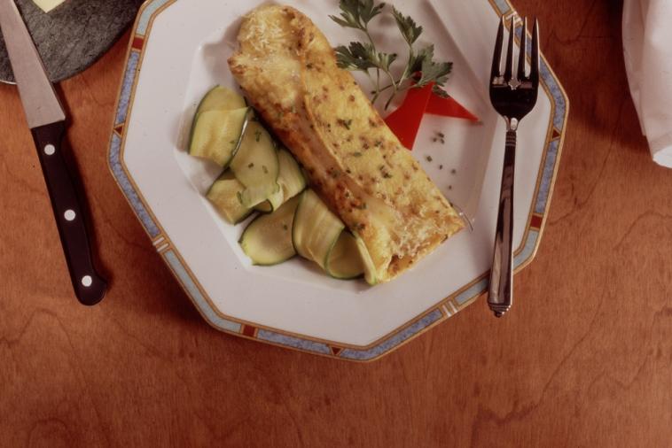 Cheese omelet with sliced zucchini served on a plate