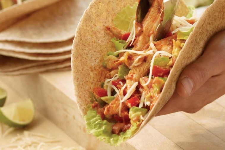 chicken fajitas with fresh salsa Fajitas topped with chicken, salsa, avocado and cheese