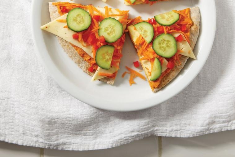 cold vegetable pizza with hummus and havarti