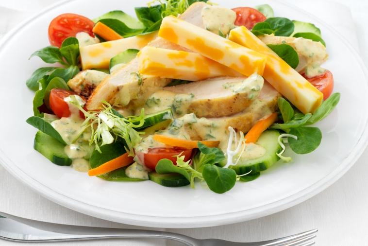green salad with grilled chicken swiss cheese and curry dressing