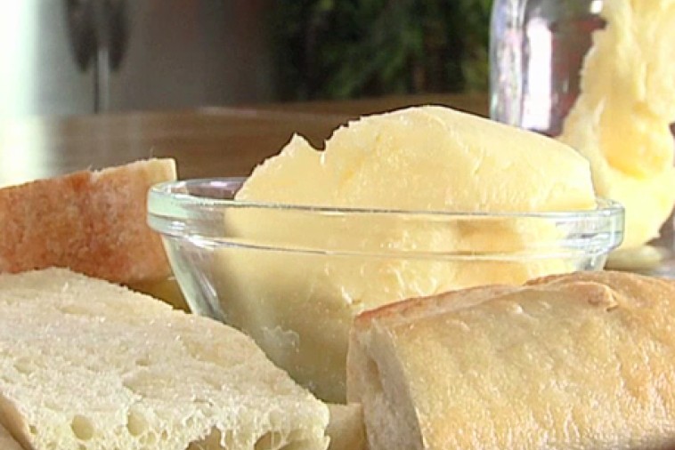 homemade butter Glass bowl of homemade butter served with fresh bread