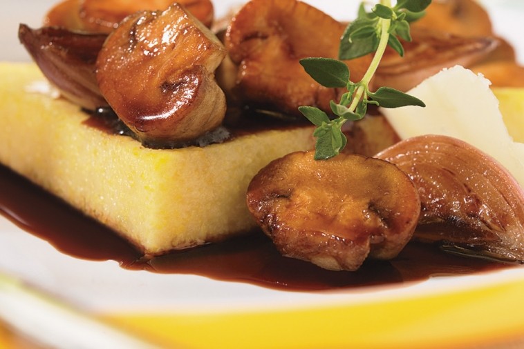 polenta made with old cheddar and topped with caramelized shallots and mushrooms polenta made with old cheddar and topped with caramelized shallots and mushrooms