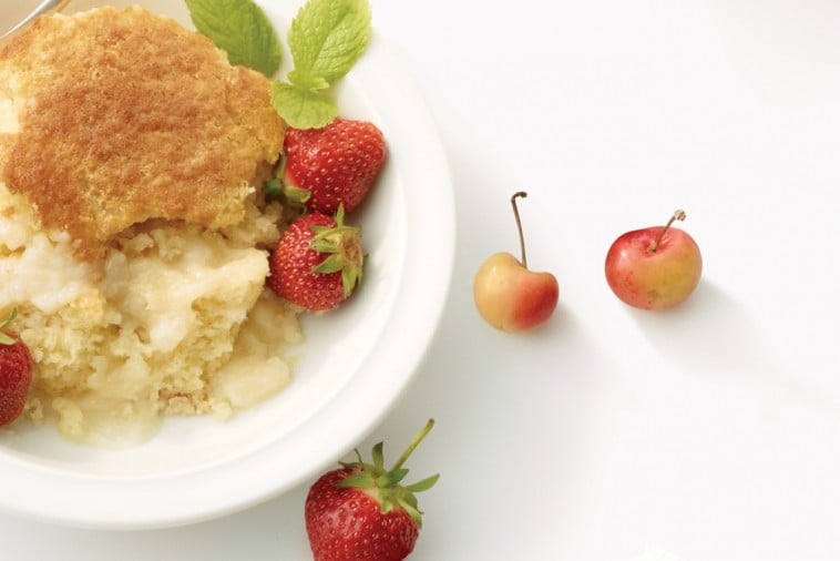 Vanilla pudding cake with mint, strawberries and cherries