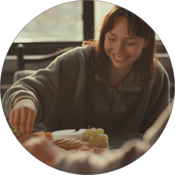 girl laughing and eating
